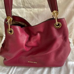 Medium Dark Red Michael Kors Leather Purse.